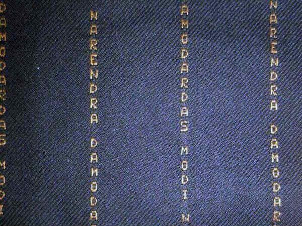 Modi's latest style: Suit with his own name stripes Modi's latest style: Suit with his own name stripes