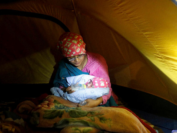 Four month old baby pulled alive from Nepal rubble 22 hours after his parents lost him during earthquake Four month old baby pulled alive from Nepal rubble 22 hours after his parents lost him during earthquake