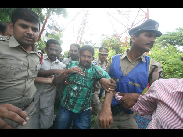 Farmer threatens to jump from cell tower Farmer threatens to jump from cell tower