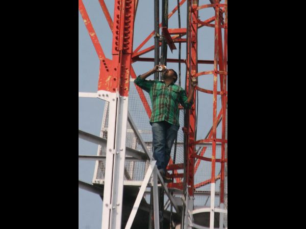 Farmer threatens to jump from cell tower Farmer threatens to jump from cell tower