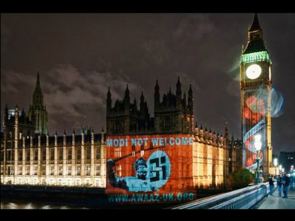 'Modi not welcome' in UK: Photo beamed on British Parliament with Swastika, sword 'Modi not welcome' in UK: Photo beamed on British Parliament with Swastika, sword