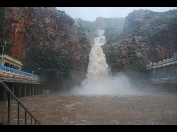 Heavy rains in AP: Waterfall touches Lord Shiva Heavy rains in AP: Waterfall touches Lord Shiva