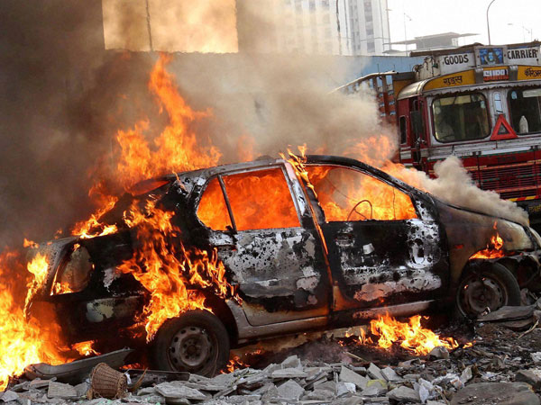 Mob strips Tanzanian girl, torches her car as police watch in Bengaluru Mob strips Tanzanian girl, torches her car as police watch in Bengaluru