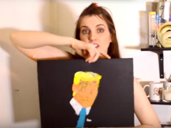 Artist paints Donald Trump using only her breasts Artist paints Donald Trump using only her breasts