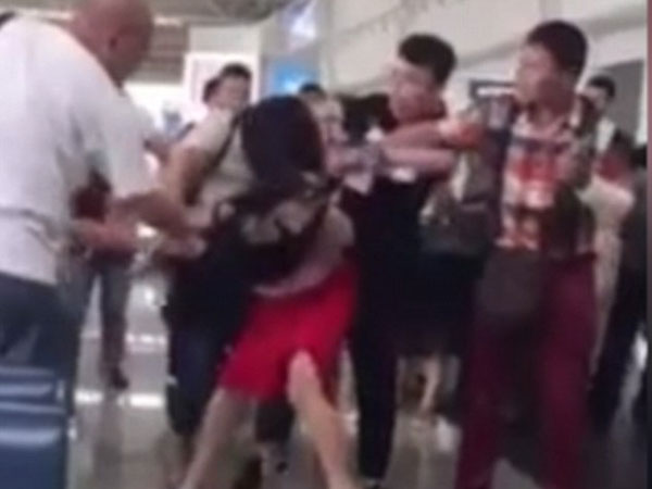 Hands off my man! Enraged wife beats and drags around husband's 'mistress' after catching 'cheating couple' on holiday Hands off my man! Enraged wife beats and drags around husband's 'mistress' after catching 'cheating couple' on holiday