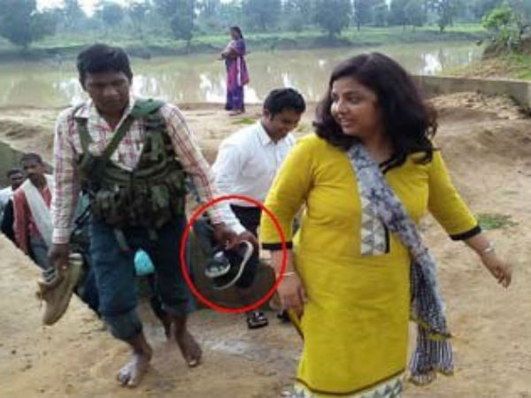 Female collector makes security guard hold chappals while river-crossing, gets trolled online! Female collector makes security guard hold chappals while river-crossing, gets trolled online!
