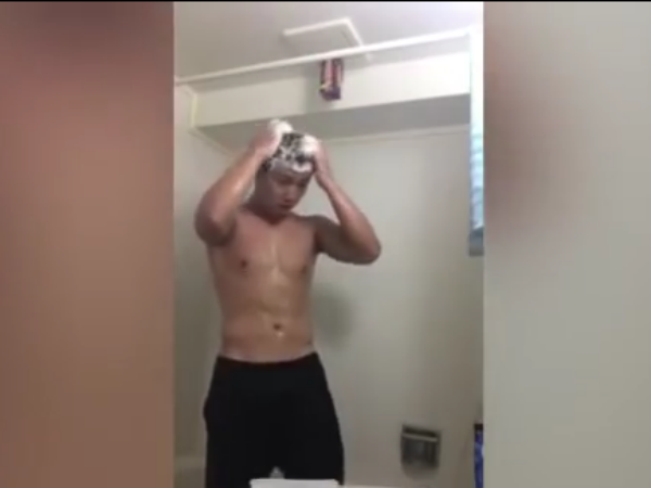 Bizarre moment man takes shower under lit FIREWORK in shocking prank Bizarre moment man takes shower under lit FIREWORK in shocking prank