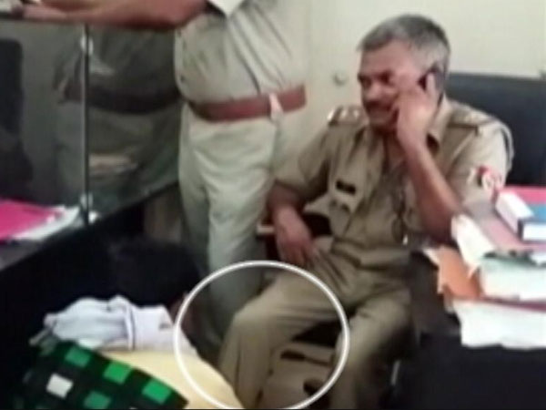 SHO humiliates man, asks him to give foot massage in UP SHO humiliates man, asks him to give foot massage in UP