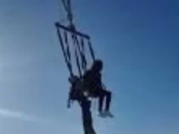 Woman Falls Out Of Swing, Dangerously Dangles Mid-Air Woman Falls Out Of Swing, Dangerously Dangles Mid-Air