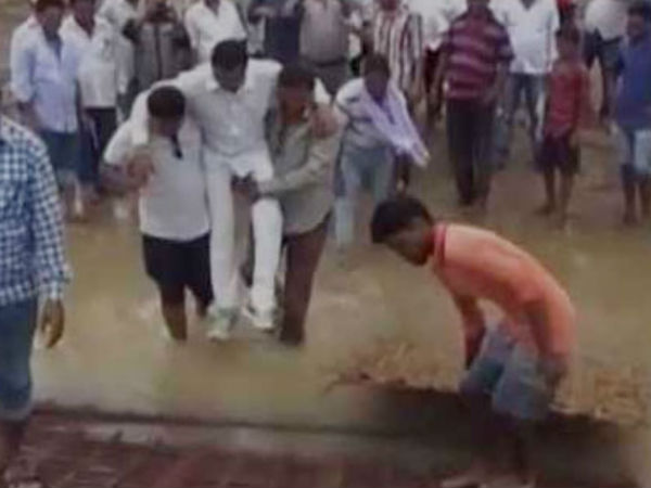Odisha MLA Manas Madkami does a Shivraj, crosses mud in supporters’ arms Odisha MLA Manas Madkami does a Shivraj, crosses mud in supporters’ arms