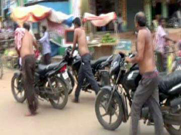 Men were paraded half naked for playing cards Men were paraded half naked for playing cards