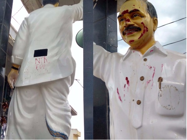 Some thugs poured red colour on ysr statue Some thugs poured red colour on ysr statue