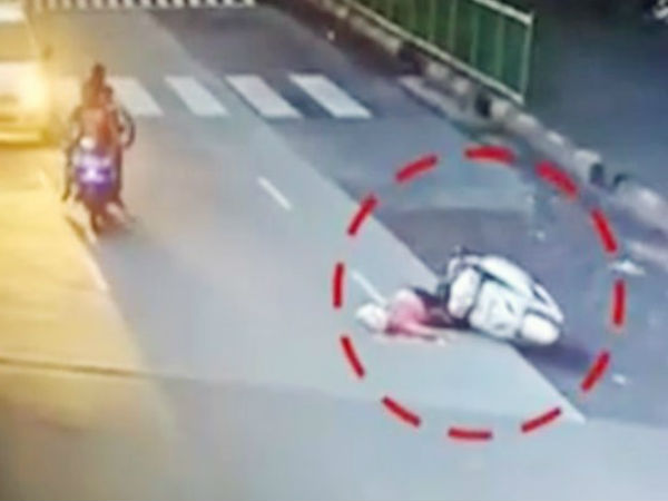 Caught on camera: Mumbai woman on scooter crushed by crane after she loses balance Caught on camera: Mumbai woman on scooter crushed by crane after she loses balance