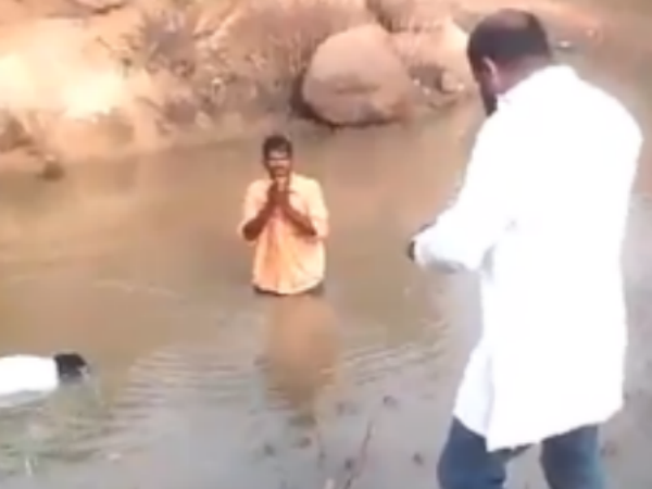 BJP leader beats 2 Dalits with stick, forces them to dip in muddy pond BJP leader beats 2 Dalits with stick, forces them to dip in muddy pond