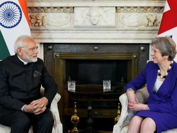 Modi raises issue of economic offenders during meeting with May Modi raises issue of economic offenders during meeting with May