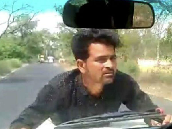 UP Government Official Drives For 4 Km As Man Clings On To Bonnet UP Government Official Drives For 4 Km As Man Clings On To Bonnet