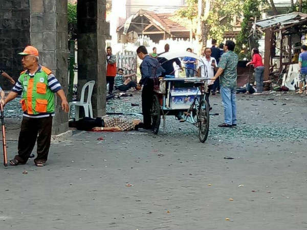 At least 10 killed in 3 church bombings in Indonesia At least 10 killed in 3 church bombings in Indonesia