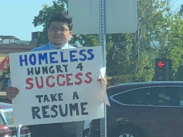 Man displays plycard for want of job amid heavy traffic,look what happened Man displays plycard for want of job amid heavy traffic,look what happened