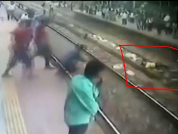 Man Lay On Rail Track In Mumbai. Dramatic Rescue Recorded On CCTV Man Lay On Rail Track In Mumbai. Dramatic Rescue Recorded On CCTV