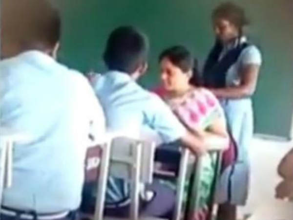Telangana teacher makes student do head massage during class time Telangana teacher makes student do head massage during class time