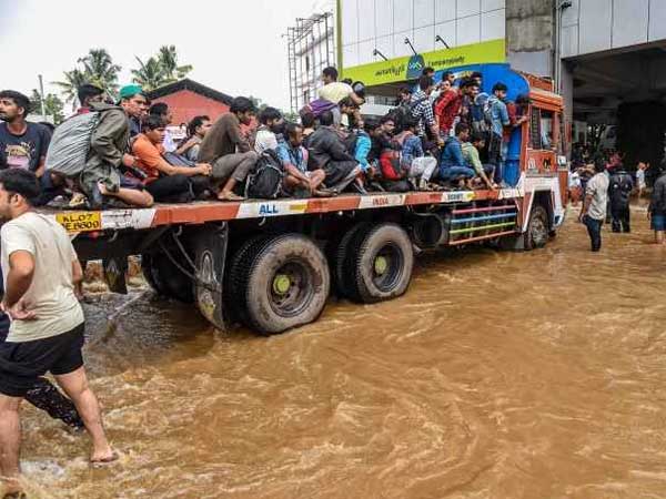Kerala fisherman bends down to pave way for women to get into rescue boat, lauded Kerala fisherman bends down to pave way for women to get into rescue boat, lauded