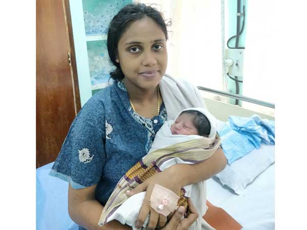 Kerala woman rescued by navy delivers baby boy Kerala woman rescued by navy delivers baby boy
