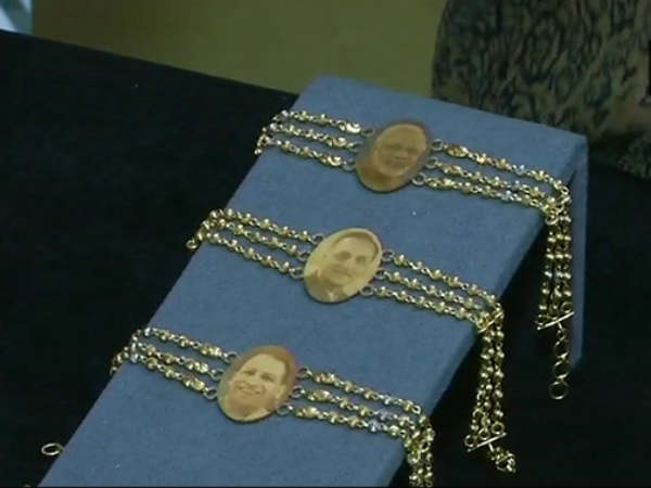 These golden Rakhis with Modi,Yogi photos are hot cakes in Surat These golden Rakhis with Modi,Yogi photos are hot cakes in Surat
