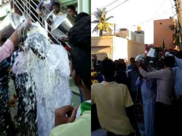 Womens candidate won in election, JDS activists have anointed her husband with milk. Womens candidate won in election, JDS activists have anointed her husband with milk.