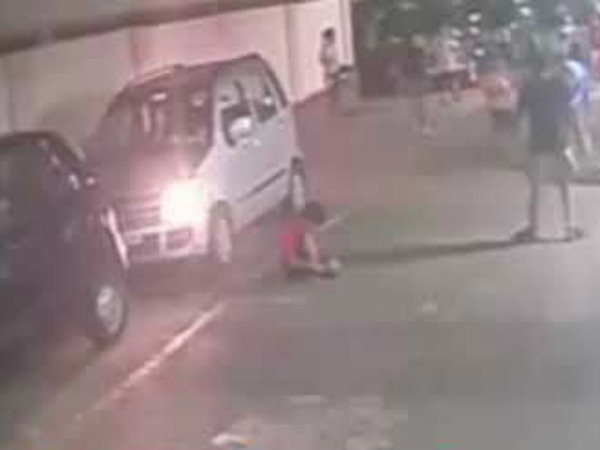 Miraculous escape caught on cam: Kid unharmed after being run over by a car Miraculous escape caught on cam: Kid unharmed after being run over by a car