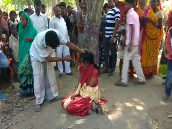 Woman in Bihar tied to a tree and thrashed for eloping Woman in Bihar tied to a tree and thrashed for eloping