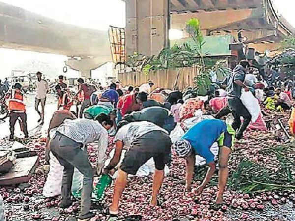 Truck carrying onions falls off bridge, locals busy stealing onion sacks instead of helping injured driver Truck carrying onions falls off bridge, locals busy stealing onion sacks instead of helping injured driver