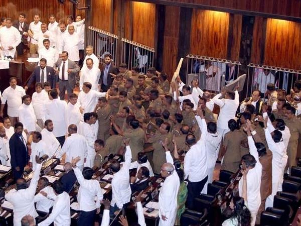 Sri Lanka MPs hurl chilli powder, chairs in Parliament commotion Sri Lanka MPs hurl chilli powder, chairs in Parliament commotion