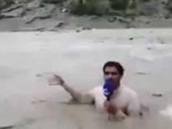 Pakistani journo gets into flooded river for report Pakistani journo gets into flooded river for report