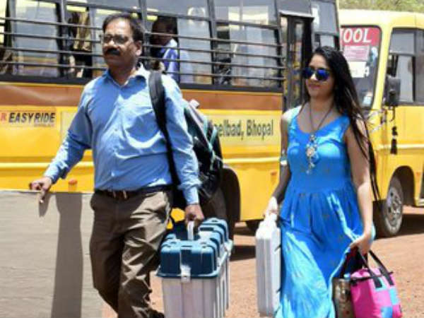 photos of lady polling officer in blue dress goes viral on social media. photos of lady polling officer in blue dress goes viral on social media.