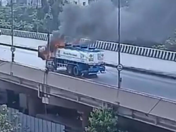 Petrol tanker catches fire on Goregaon flyover, traffic affected Petrol tanker catches fire on Goregaon flyover, traffic affected