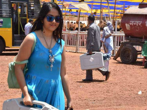 photos of lady polling officer in blue dress goes viral on social media. photos of lady polling officer in blue dress goes viral on social media.