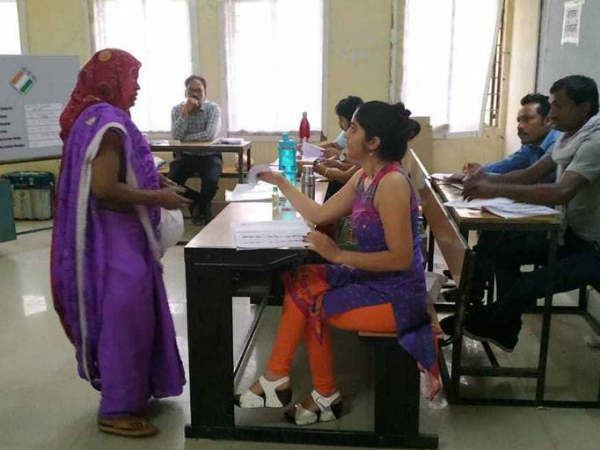 photos of lady polling officer in blue dress goes viral on social media. photos of lady polling officer in blue dress goes viral on social media.