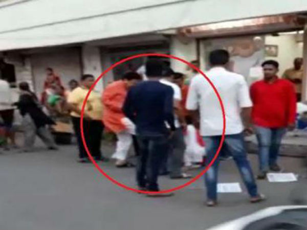 Naroda MLA Balram Thavani kicks woman,video goes viral Naroda MLA Balram Thavani kicks woman,video goes viral