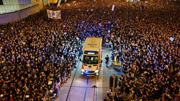 Hong Kong protesters let an ambulance go through the massive protest Hong Kong protesters let an ambulance go through the massive protest