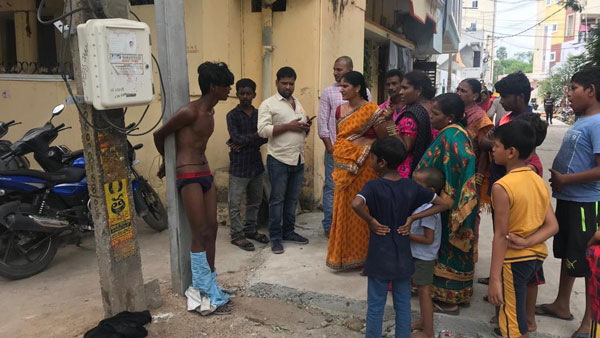Youth tied to a poll beaten up by women for misbehaving Youth tied to a poll beaten up by women for misbehaving