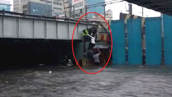 Woman pulled out of flooded Milan subway in Andheri Woman pulled out of flooded Milan subway in Andheri