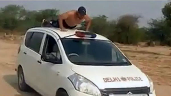 A TikTok video showing a man performing dangerous stunts on a dummy Delhi Police car A TikTok video showing a man performing dangerous stunts on a dummy Delhi Police car