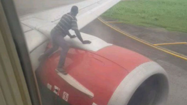 Man climbs on plane’s wing moments before takeoff Man climbs on plane’s wing moments before takeoff