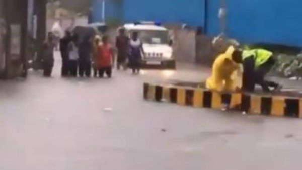 Mumbai Police officer saves dog from drowning during floods. Big salute, says Internet Mumbai Police officer saves dog from drowning during floods. Big salute, says Internet