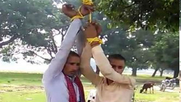 Father and son thrashed, made to do sit ups by locals Father and son thrashed, made to do sit ups by locals