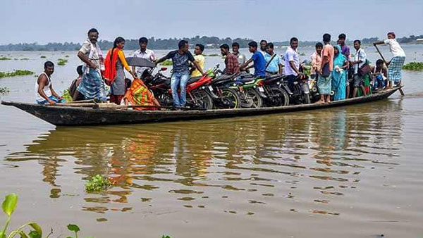 Eight districts with 63,000 people flooded in Assam Eight districts with 63,000 people flooded in Assam