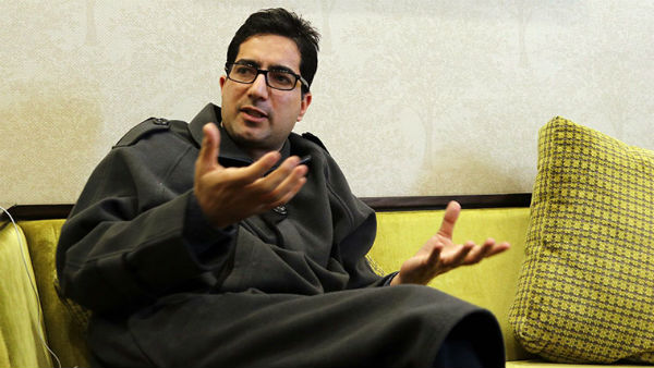 Former IAS officer Shah Faesal detained at Delhi airport, placed under house arrest in Kashmir Former IAS officer Shah Faesal detained at Delhi airport, placed under house arrest in Kashmir