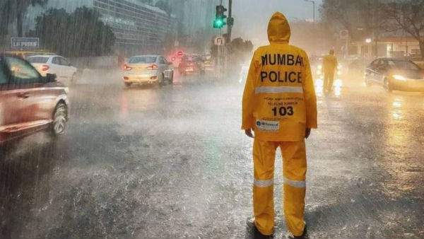 Mumbai rains stop life in the city for all but traffic cops. Internet hails the heroes Mumbai rains stop life in the city for all but traffic cops. Internet hails the heroes