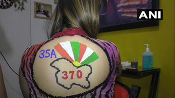 Surat women pose with Chandrayaan-2, Article 370 body paint tattoos during Navratri preps Surat women pose with Chandrayaan-2, Article 370 body paint tattoos during Navratri preps
