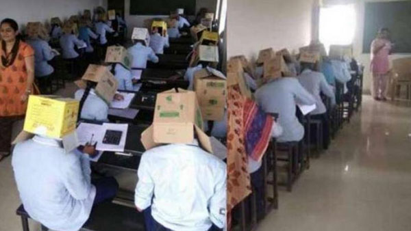 విద్యార్థుల తలలకు అట్టపెట్టెలు